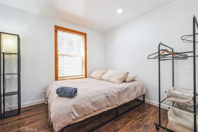 bedroom featuring dark wood-style floors, recessed lighting, and baseboards