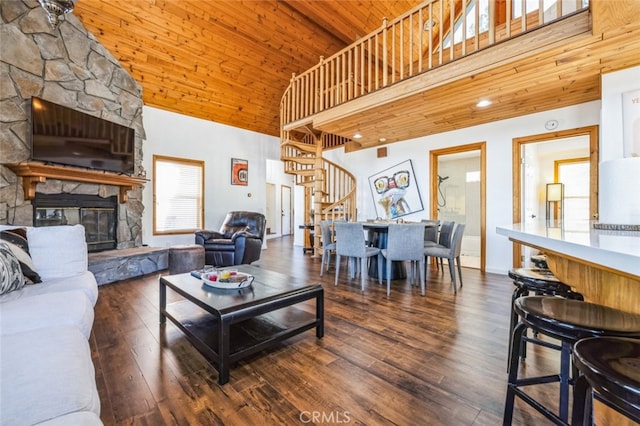 living room with a fireplace, wood-type flooring, stairway, high vaulted ceiling, and wooden ceiling