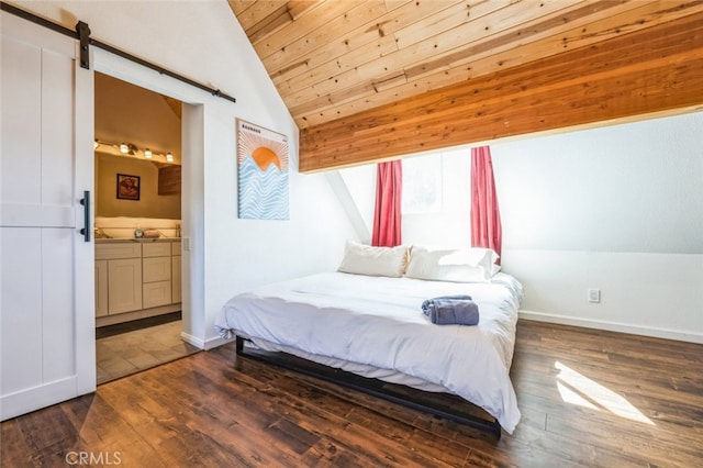 bedroom featuring wood ceiling, lofted ceiling, wood finished floors, and a barn door