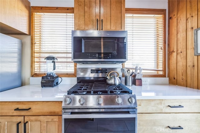 kitchen with stainless steel appliances and light countertops