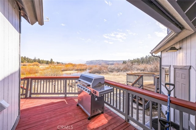 wooden deck featuring area for grilling