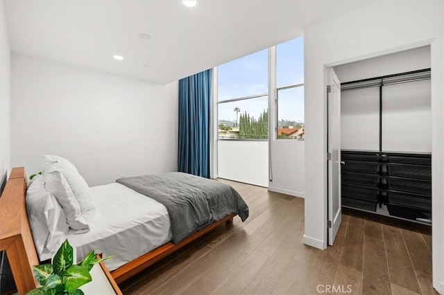 1923 N Gower St, Los Angeles, CA 90068 - bedroom featuring wood finished floors, recessed lighting, baseboards, and a closet