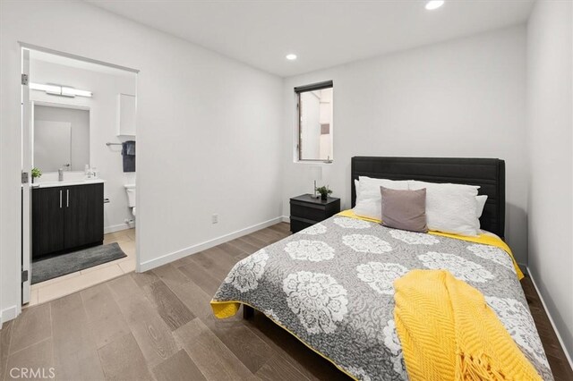 1923 N Gower St, Los Angeles, CA 90068 - bedroom featuring wood finished floors, recessed lighting, baseboards, and ensuite bathroom