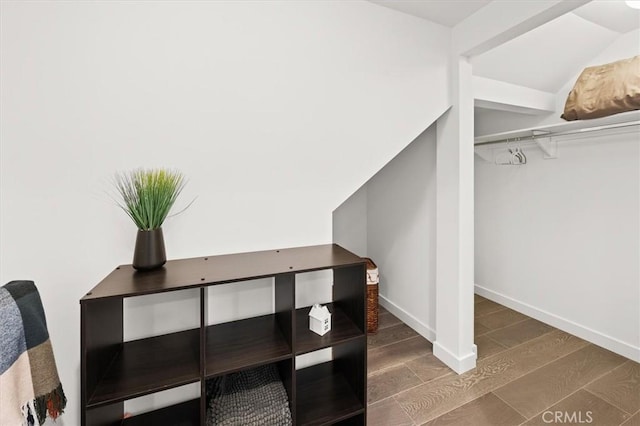 1923 N Gower St, Los Angeles, CA 90068 - walk in closet featuring wood finished floors and lofted ceiling
