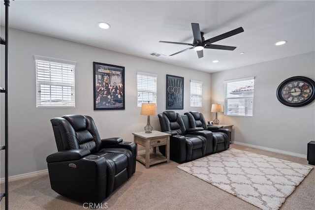 carpeted home theater with baseboards, recessed lighting, and a healthy amount of sunlight