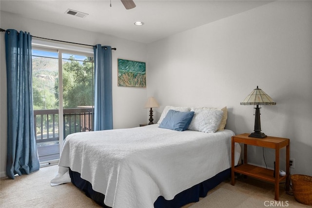 carpeted bedroom with a ceiling fan, visible vents, and access to exterior