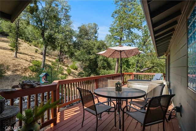 wooden terrace featuring outdoor dining space