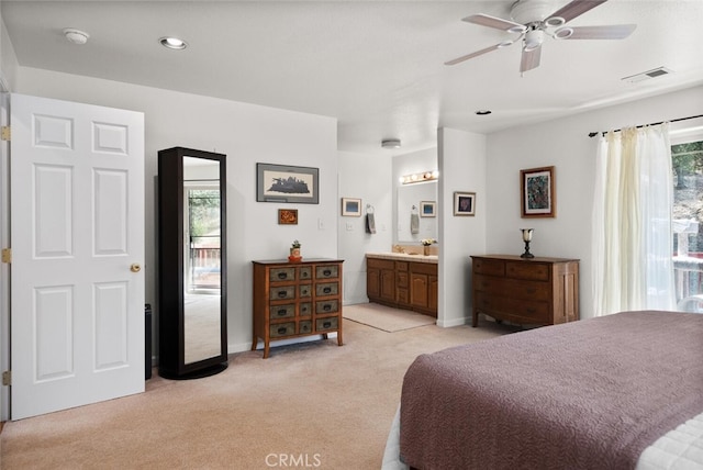 bedroom featuring light carpet, visible vents, baseboards, ensuite bath, and recessed lighting