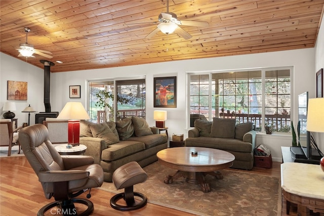 living room featuring a ceiling fan, wooden ceiling, vaulted ceiling, and wood finished floors