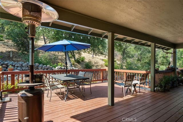 wooden deck with outdoor dining area