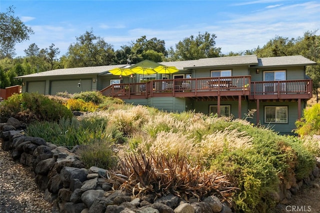 back of house with a garage