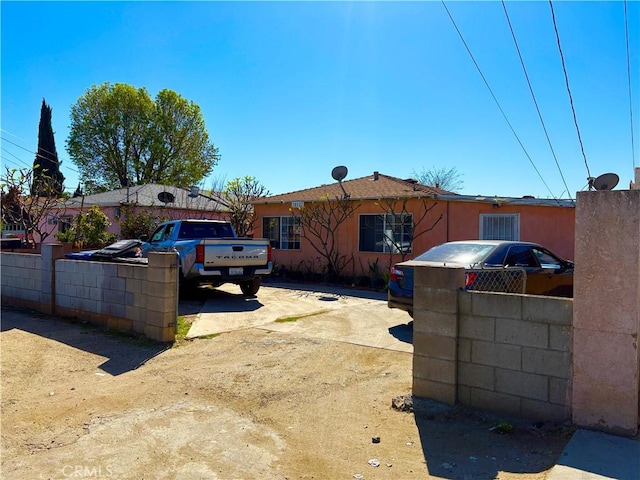 view of home's exterior featuring fence