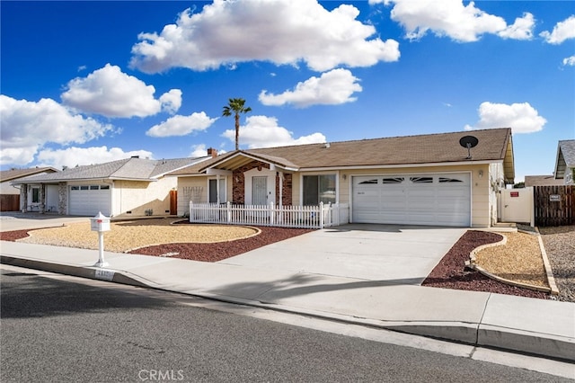 single story home with a garage, driveway, and fence