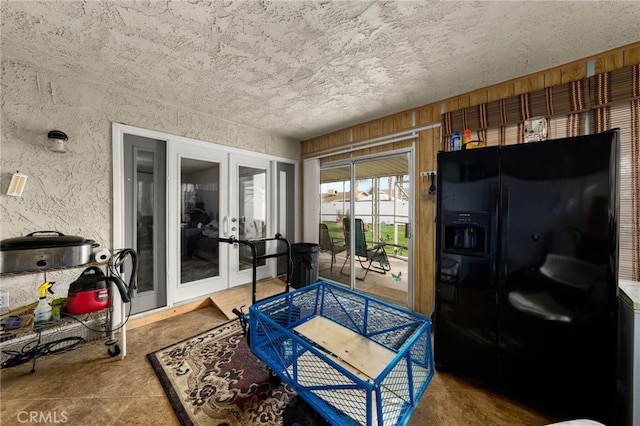 26131 Chambers Ave, Menifee, CA 92586 - living room with french doors, a textured ceiling, and concrete flooring