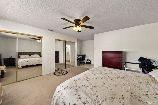 26131 Chambers Ave, Menifee, CA 92586 - carpeted bedroom featuring two closets, a ceiling fan, and a textured ceiling