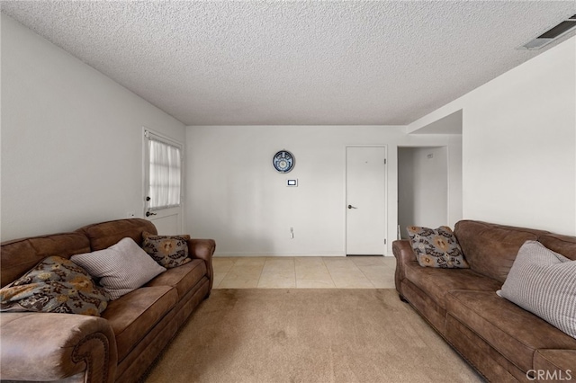 26131 Chambers Ave, Menifee, CA 92586 - living area with a textured ceiling, light tile patterned floors, and light carpet