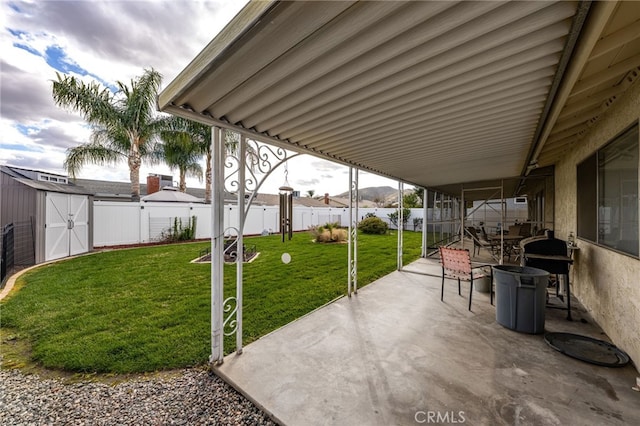 26131 Chambers Ave, Menifee, CA 92586 - view of patio with a storage unit and an outbuilding