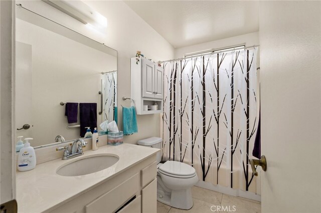 26131 Chambers Ave, Menifee, CA 92586 - full bathroom with toilet, tile patterned flooring, vanity, and shower / tub combo with curtain