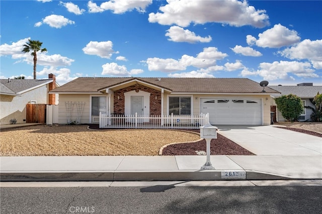 26131 Chambers Ave, Menifee, CA 92586 - single story home with an attached garage, driveway, and a fenced front yard
