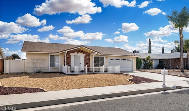 ranch-style house featuring driveway, a garage, fence, and brick siding