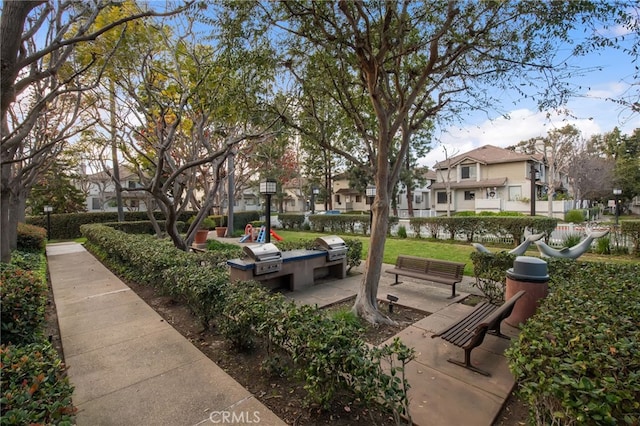 surrounding community featuring a patio area, fence, and a residential view