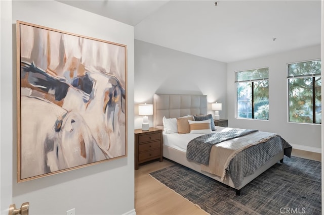 bedroom featuring wood finished floors