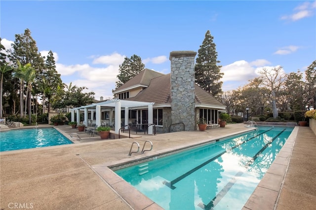 community pool featuring a patio area