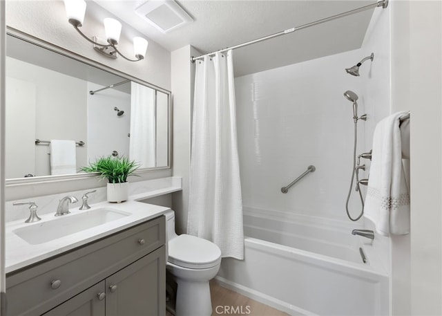 full bathroom featuring shower / tub combo, visible vents, vanity, and toilet