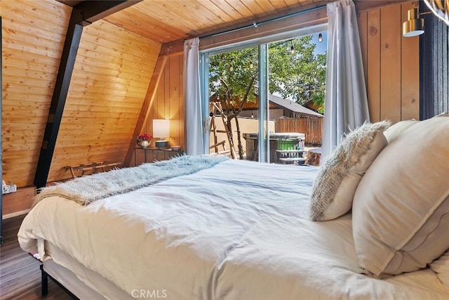 bedroom featuring wood finished floors, wooden ceiling, wood walls, access to exterior, and vaulted ceiling with beams