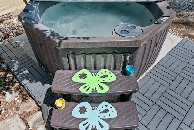 wooden terrace with a hot tub