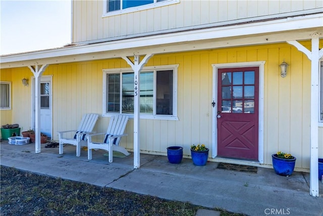 property entrance with covered porch