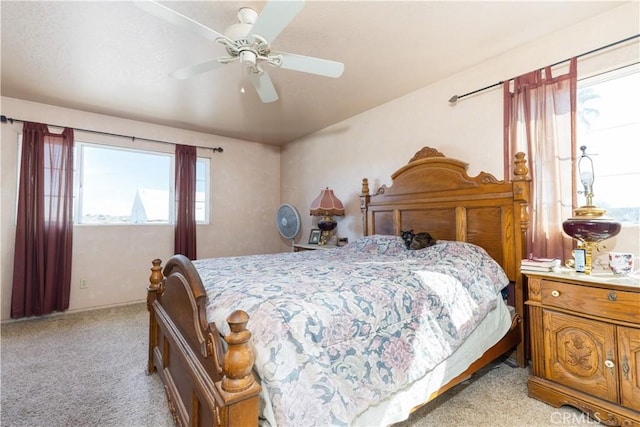 bedroom featuring ceiling fan and light carpet