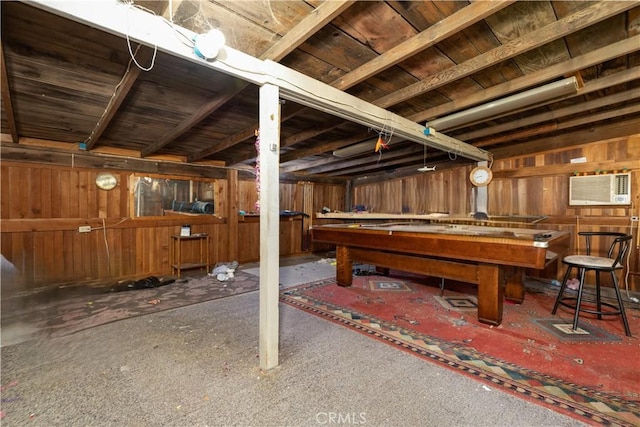 playroom featuring wood walls, pool table, and a wall unit AC