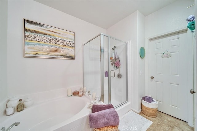 full bath featuring a stall shower, tile patterned flooring, and a bath