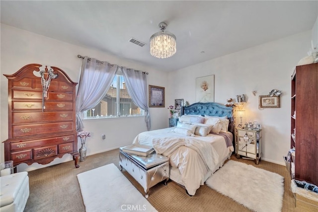 bedroom with a chandelier, visible vents, carpet floors, and baseboards