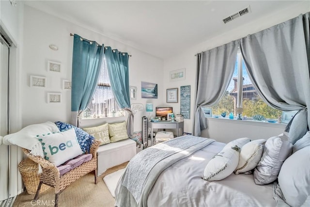 bedroom featuring visible vents