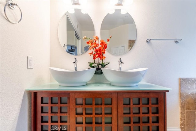 details featuring a sink and double vanity