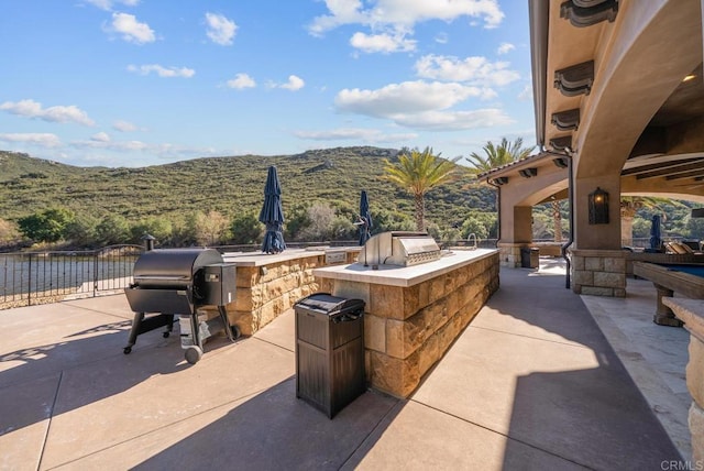 4065 Via Palo Verde Lago, Alpine, CA 91901 - view of patio / terrace with exterior kitchen, a mountain view, and area for grilling