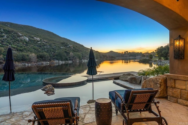 4065 Via Palo Verde Lago, Alpine, CA 91901 - pool at dusk with a patio, a water and mountain view, and a pool with connected hot tub