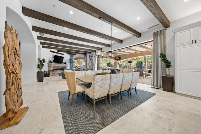 4065 Via Palo Verde Lago, Alpine, CA 91901 - dining area featuring recessed lighting, visible vents, an inviting chandelier, a warm lit fireplace, and beamed ceiling