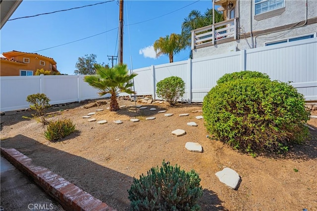 view of yard with a fenced backyard