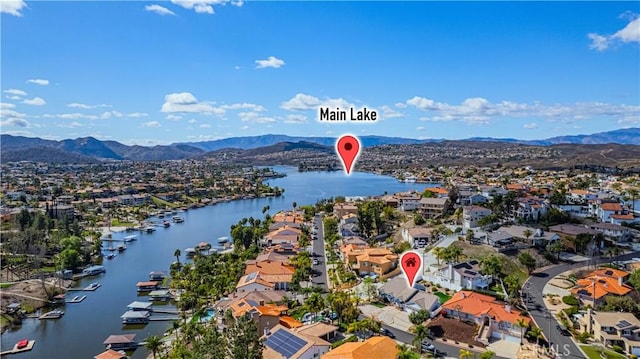 bird's eye view featuring a residential view and a water and mountain view