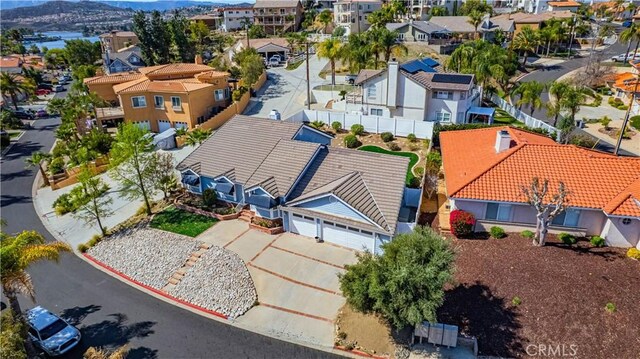 birds eye view of property with a mountain view and a residential view