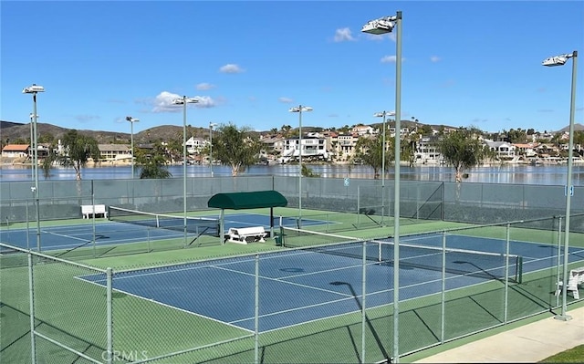 view of sport court with fence