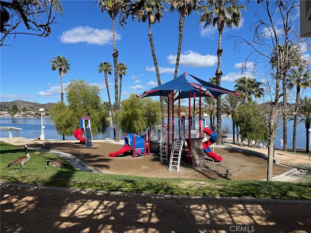 communal playground with a water and mountain view