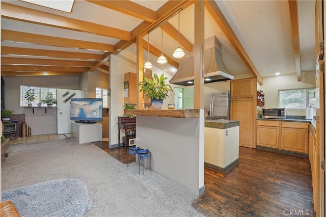 30919 Valley Oak Dr, Running Springs, CA 92382 - kitchen with appliances with stainless steel finishes, open floor plan, ventilation hood, dark countertops, and a peninsula