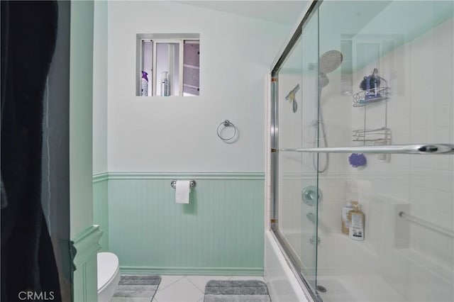 30919 Valley Oak Dr, Running Springs, CA 92382 - full bathroom with a wainscoted wall, shower / bath combination with glass door, and tile patterned floors