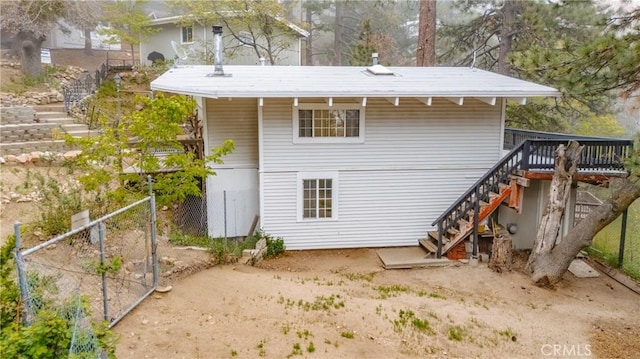 30919 Valley Oak Dr, Running Springs, CA 92382 - back of house with stairway and a deck