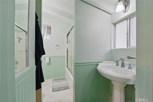 30919 Valley Oak Dr, Running Springs, CA 92382 - bathroom with wainscoting, enclosed tub / shower combo, and tile patterned floors