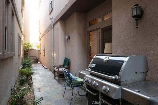 view of patio / terrace with grilling area and a gate